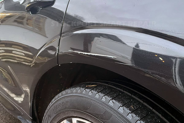 rear wheel arch scuff before painting - Stockport Smart Repair Gallery